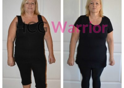 a blond woman standing in front of a white door wearing the same clothes to illustrate her weight loss